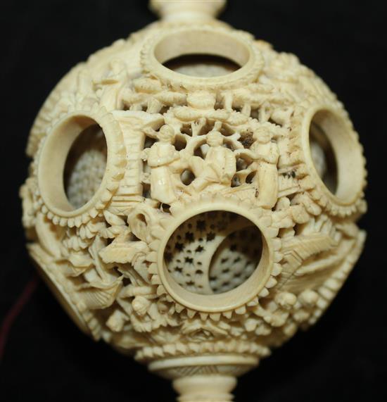 A Chinese export ivory hanging puzzle ball, 19th century, 34cm incl. chain